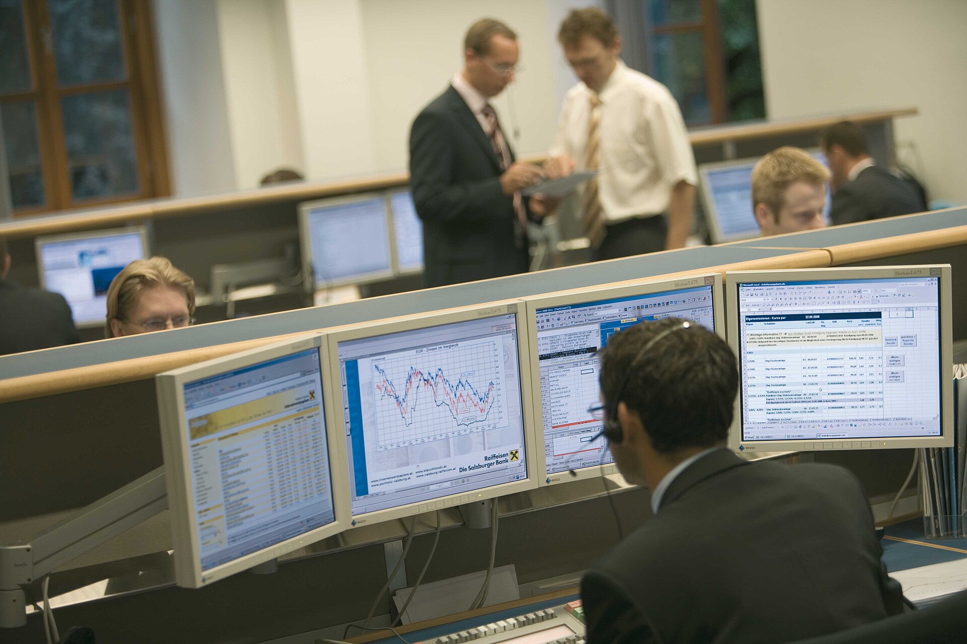 A bank trading room with multi-monitor workstations in Salzburg, Austria